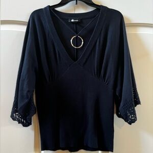 AB Studio- black blouse with detailed sleeves and silver necklace